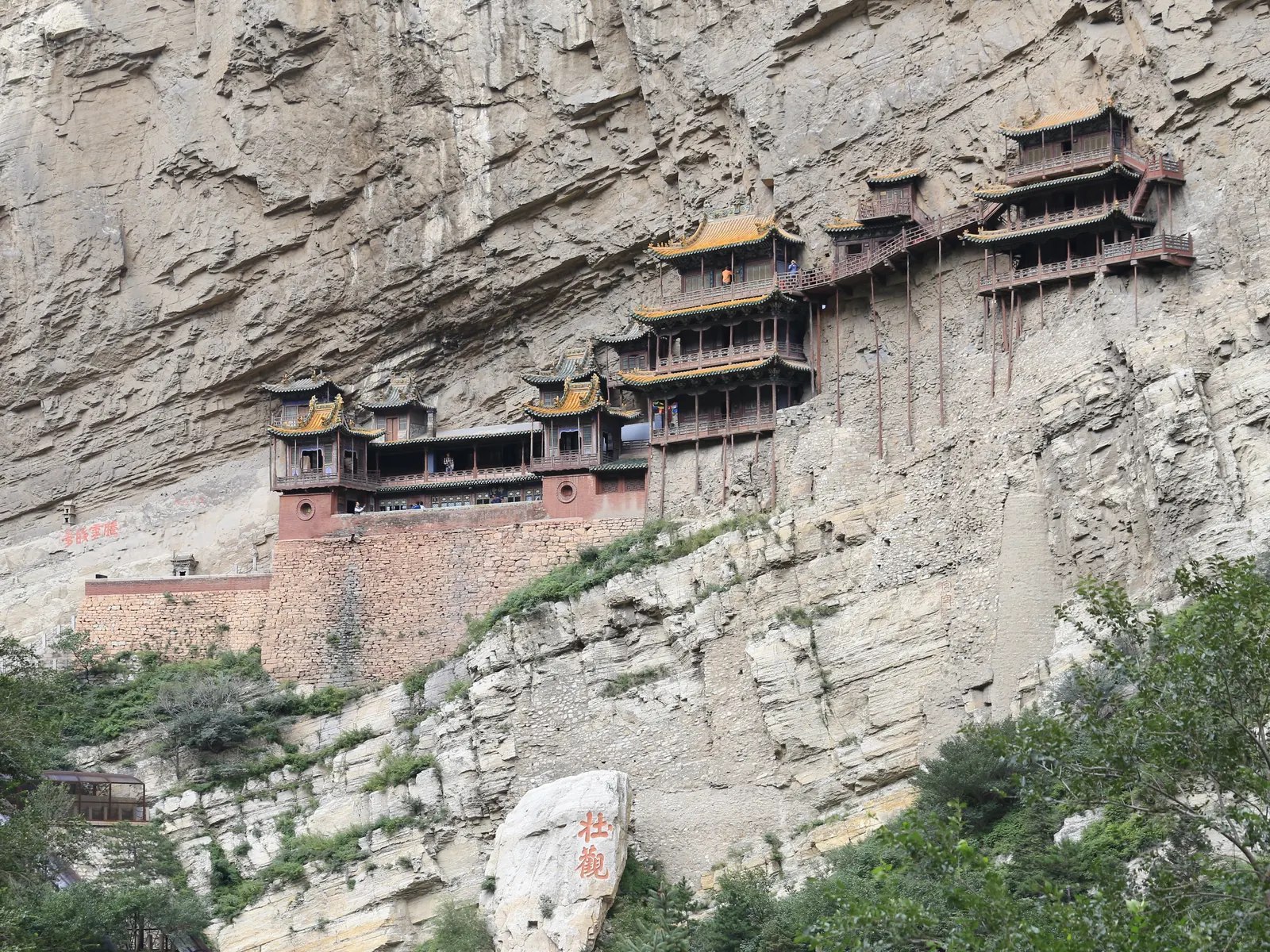 The Hanging Temple pinned to a vertical cliff face on half-exposed timber beams at Mount Heng.