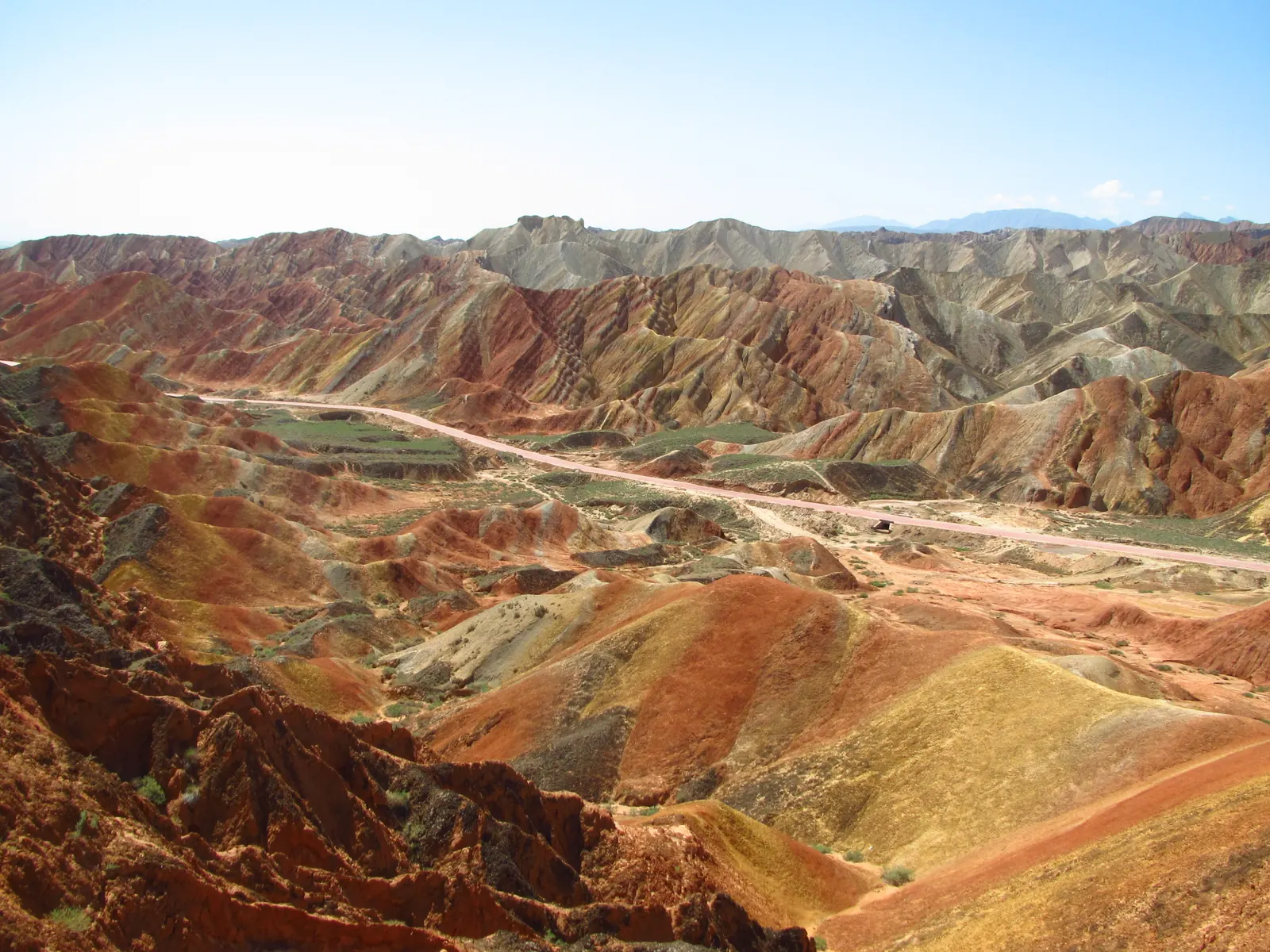 The striped rainbow hills of Zhangye Danxia under a high desert sky.